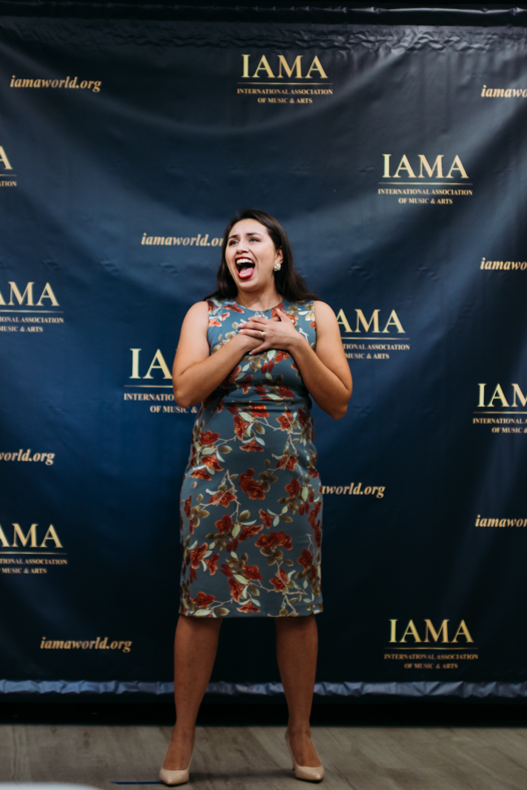 Young artist singing during the IAMA vocal competition