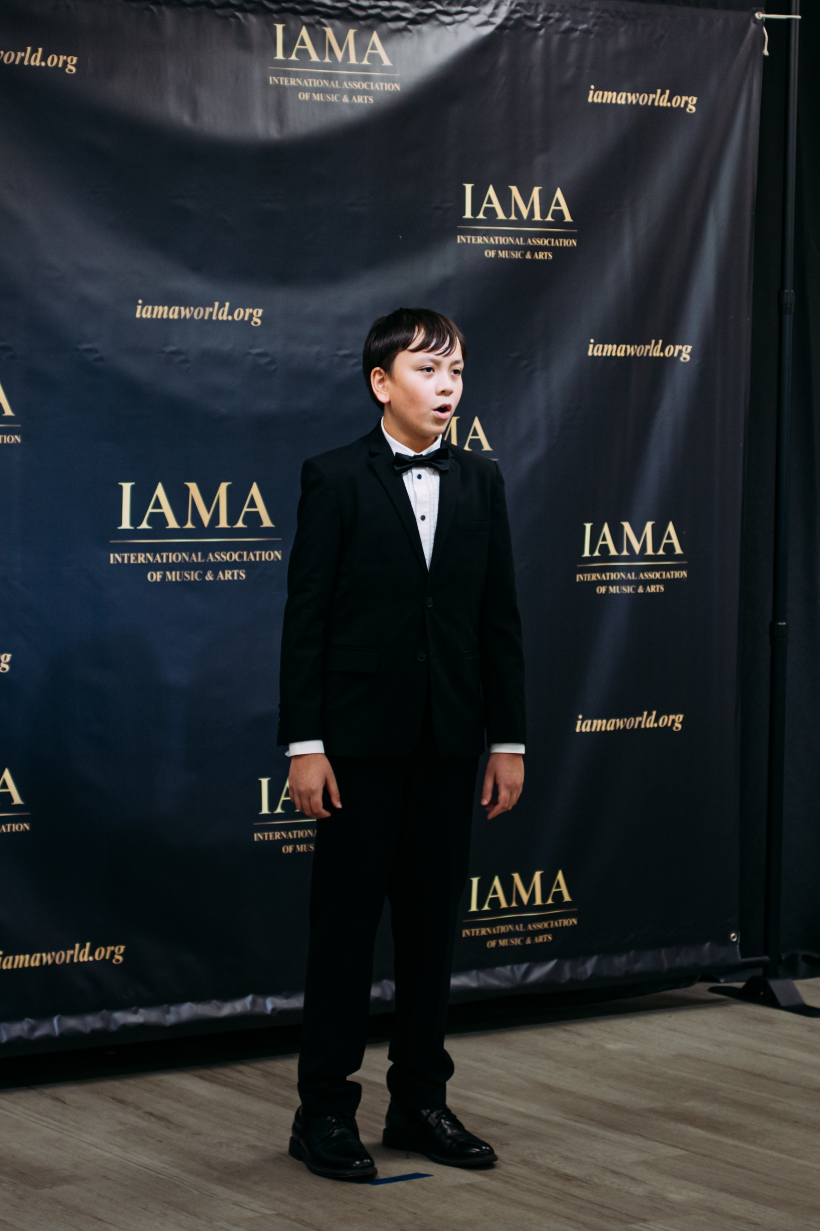 Festival singer performing for judges and audience