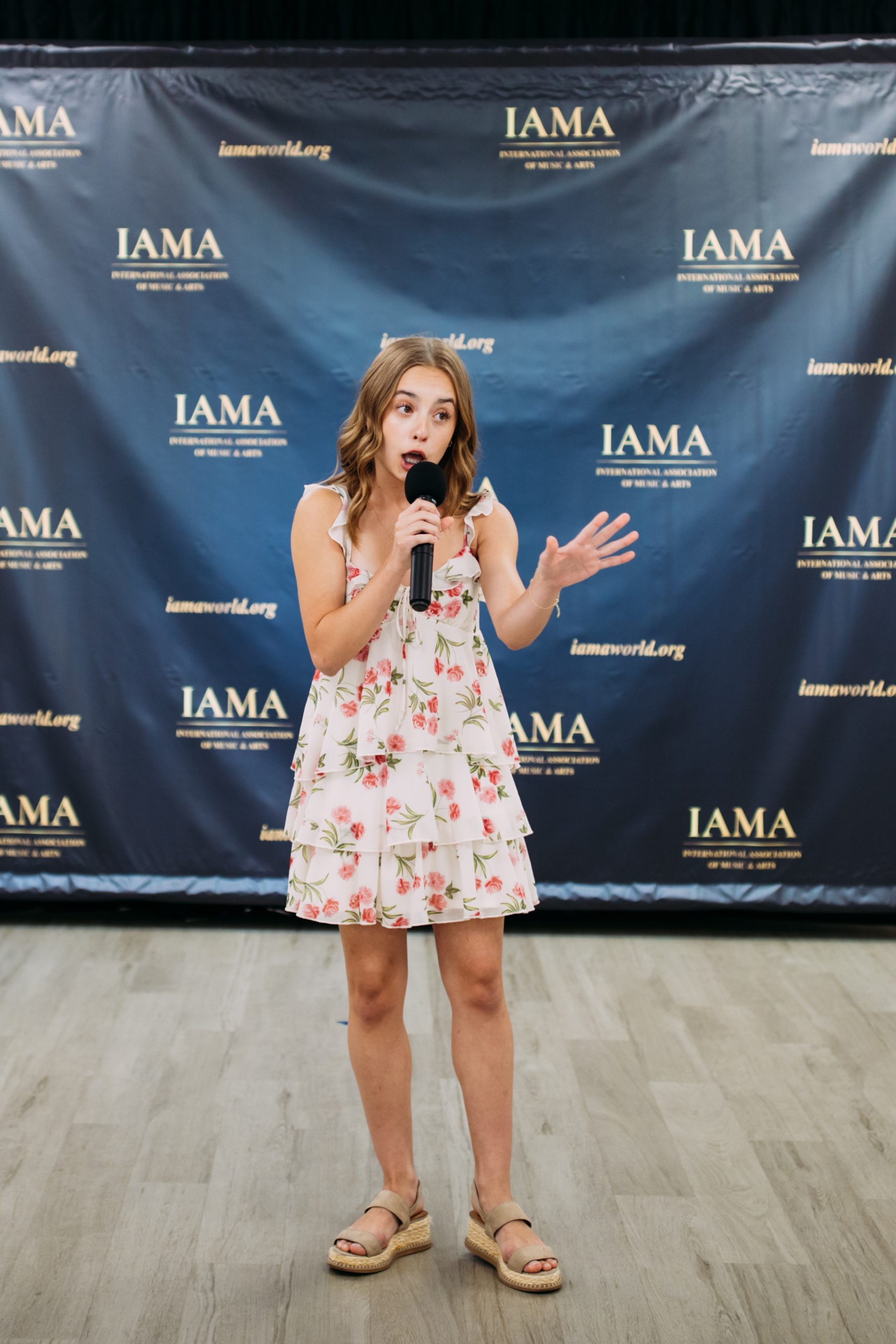 Vocal competitor performing on the IAMA competition stage