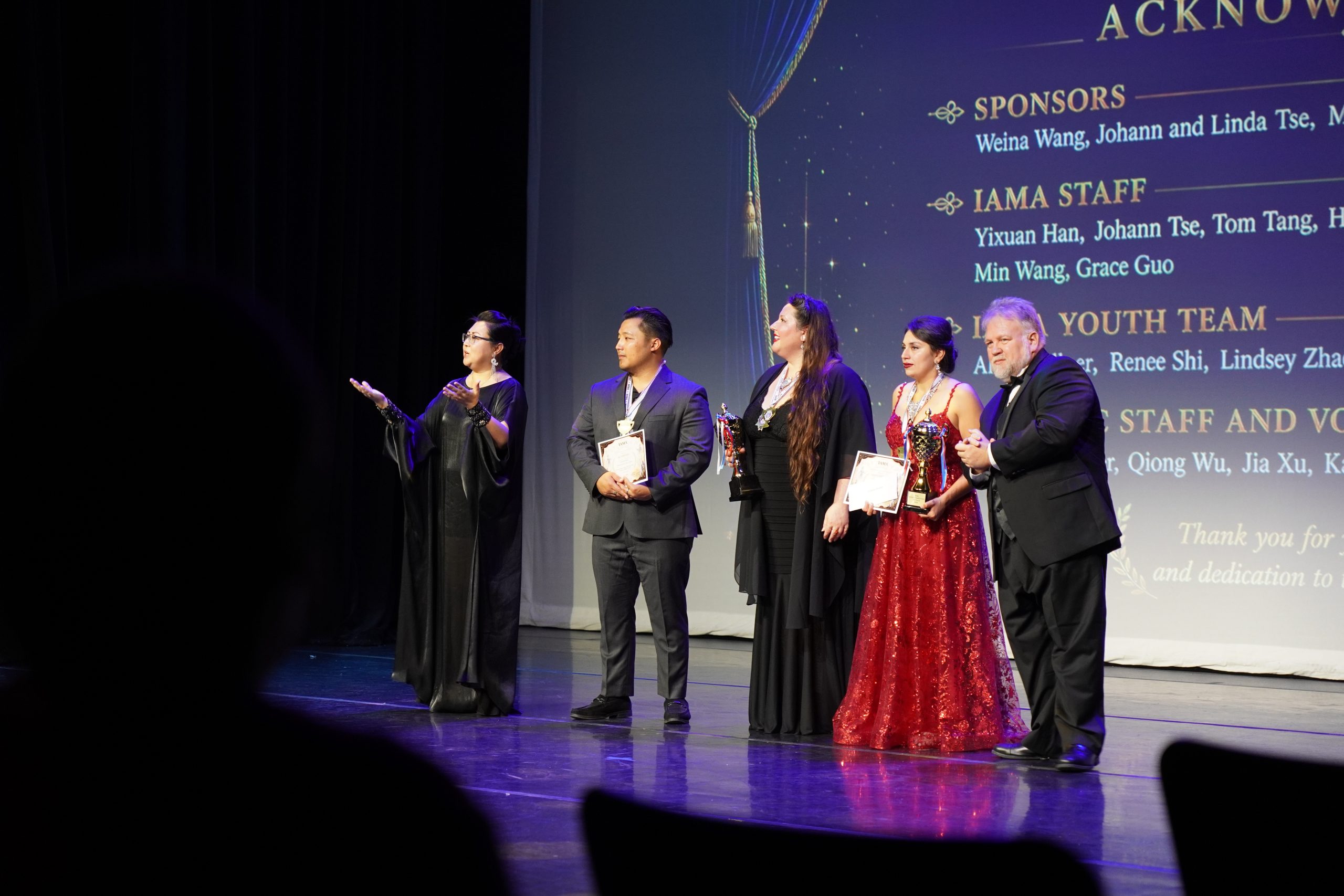 IAMA artistic leadership and award recipients on the Gala stage